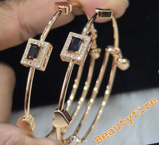 Minimalist, rigid open-ended bangle bracelet.